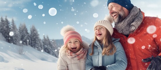 Family enjoying snowy vacation with playful snowball fight copy space image - obrazy, fototapety, plakaty