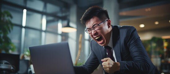 Furious Asian boss shouting at laptop man failing in twisted office copy space image - obrazy, fototapety, plakaty