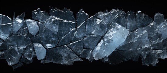 Crushed ice with cracks on black surface copy space image