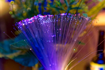 Close-up of colorful light decoration with bunch of fibre glass inside of barn at Swiss City of...