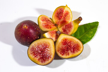 cut figs with colored filling, on a plain white background