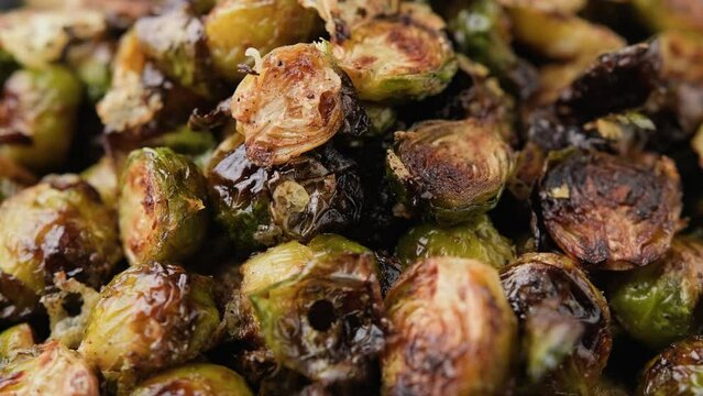 Oven roasted Brussel Sprouts with herbs and cheese. Rotating video