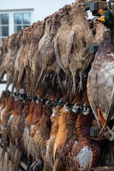 Pheasant and duck bird hunting in Scandinavia during late autumn, Hunters selling the birds at a...