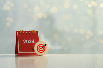 2024 Happy New Year background. calendar and wooden cubes with goal icons. Set up objective target business cost and budget planning for the new year. life and business Planning for goal and success. - obrazy, fototapety, plakaty