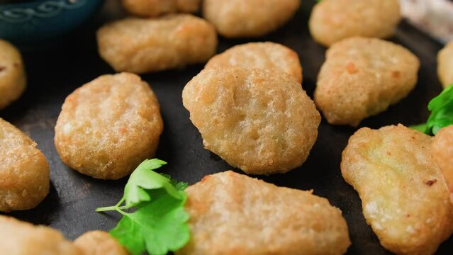 Crispy Jalapeno Popper with creamy cheese battered party food bites. Rotating video