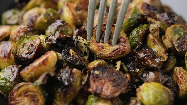 Eating Oven roasted Brussel Sprouts with fork
