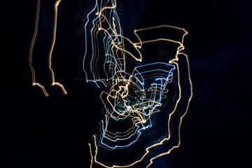 Abstract light patterns from cars at night using intentional camera movement