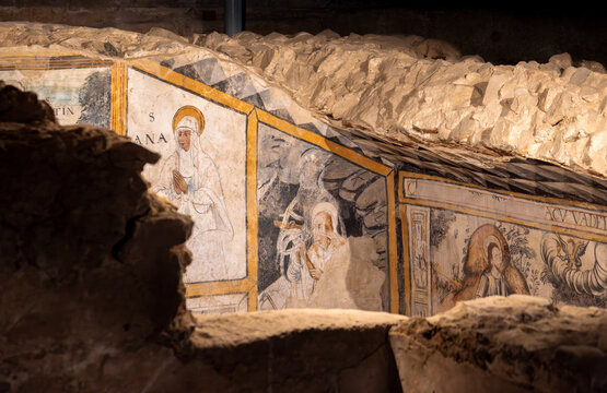 Religious paintings and frescoes of saints and the passion of Christ in the early Christian crypt in the basements of the church of the martyr Saint Eulalia. Ancient early Christian necropolis. Merida