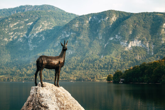 Ribcev Laz, Slovenia - August 27, 2023: Goldenhorn (Zlatorog) statue near the Lake Bohinj is a reference to a popular Slovenian legend of the Golden Horned Deer