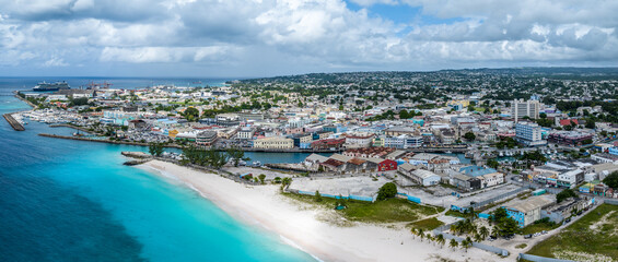 Aerial landscape view of Bay Area of Carlisle Bay at Bridgetown, Capital of Barbados with Brownes Beach in front and central City of Bridgetown, (Saint Michael) and Cruise Port Terminal in background - obrazy, fototapety, plakaty