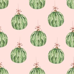 Seamless pattern with watercolor green Christmas balls on a pink background. Used for printing gift wrapping paper, textile and fabric.