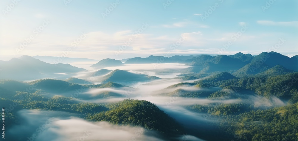 Wall mural Foggy landscape in the jungle. Fog and cloud mountain tropic valley landscape. aerial view, wide misty panorama - Wall murals