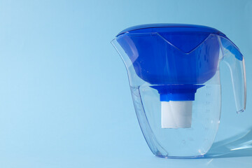 Water filter with a blue cap on a blue background