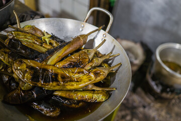 Grilled pepper in the silver wok in the local market in Phnom Penh