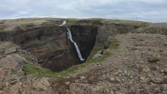 SLOW MOTION SHOT - Granni is a waterfall in the river Foss&aacute; next to H&aacute;ifoss, the second highest waterfall of Iceland, after Glymur, with a single drop of 122 meters.