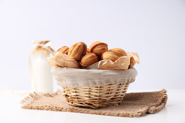 Nut cookies in a flying bowl on a white background