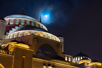 Islamic or ramadan background photo. Full moon and Buyuk Camlica Mosque