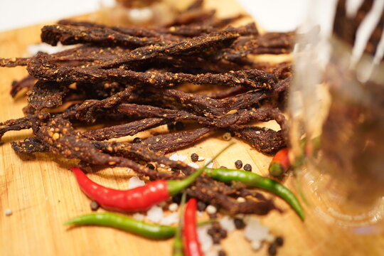 Strips of dry beef chili jerky with salt and chilies