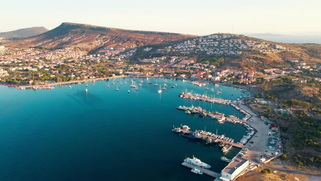 Lagoon marina with boats and yachts in Foca resort town in Turkey on Aegean sea coast. Aerial view
