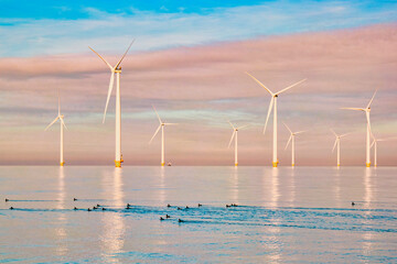 Windmills for electric power production Netherlands Flevoland, Wind turbines farm in the sea,...