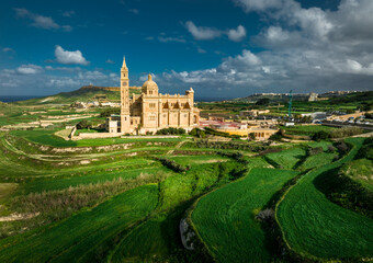Aerial Drone photo of The Sanctuary of Ta’ Pinu in Gozo, Malta—a revered pilgrimage site with spiritual significance.