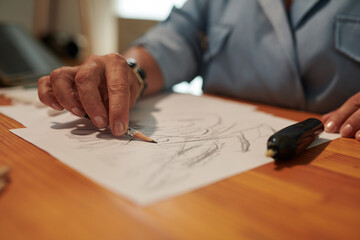Closeup image of woman drawing with lead pencil, leisure time conccept