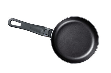 Empty iron frying pan on rustic table.  Transparent background. Isolated.