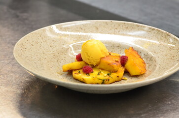 grilled pineapple with mango sorbet, served in a restaurant