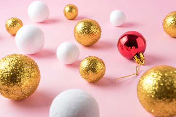 Gold and white glitter ball decoration with red Christmas bauble