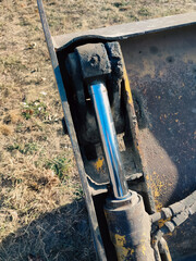 Tractors, bulldozers, excavators hydraulic system. Details of construction equipment. Close up of...