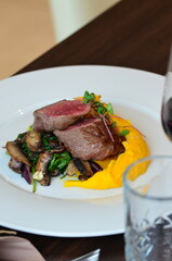 close up view of grilled steak, medium, served food on white plate