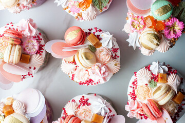 Beautiful traditional Orthodox Easter cakes decorated with glaze, meringues, chocolate, nuts, toffees, macaroons, flowers and jelly