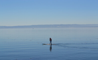 doing paddle board in the pacific ocean