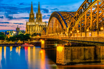 Cologne Koln Germany during sunset, Cologne Hohenzollern bridge over the Rhein River with a view at the skyline of Cologne Koln