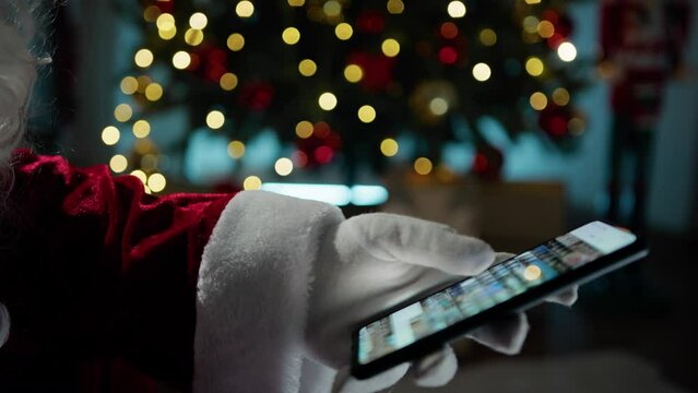 Santa Claus searching on his photo gallery 