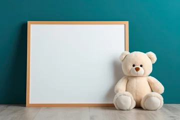 Foto op Plexiglas teddy bear sitting near empty wooden frame on green walls. mockup for nursery art © Rangga Bimantara