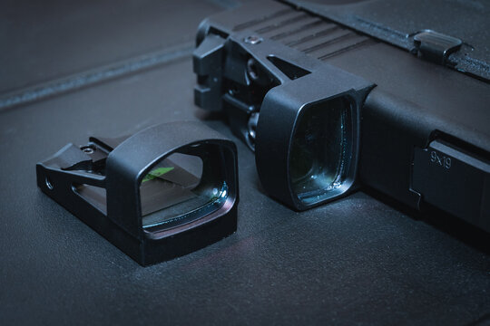 Modern Red dot sights for pistols. Close-up photo.