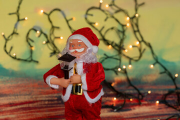 Santa Claus and Christmas puppets on abstract background with copy space