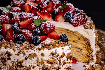 Close up of Crepe Cake with Swiss Meringue Buttercream Frosting with slice