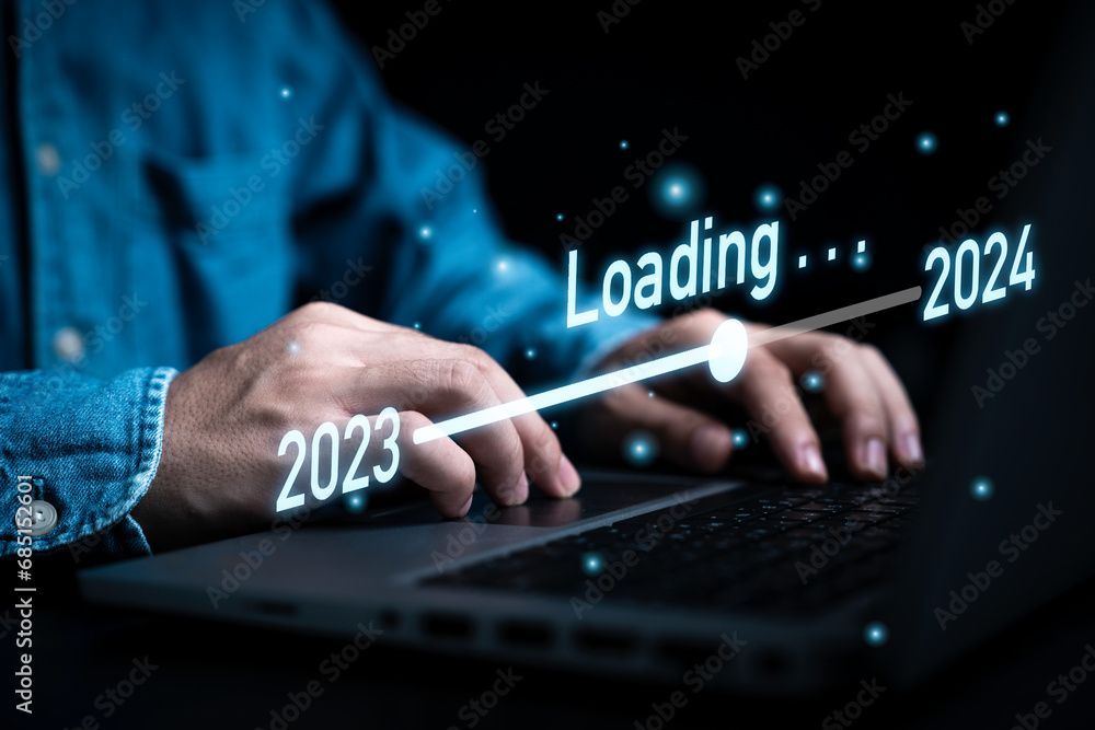 Poster businessman using laptop computer with downloading tool bar for countdown 2023 to 2024 , merry chris