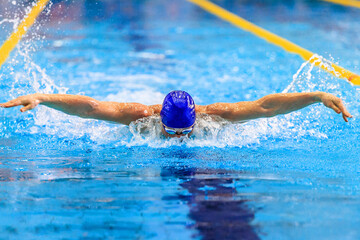 male swimmer swim butterfly stroke competition race, summer sports games