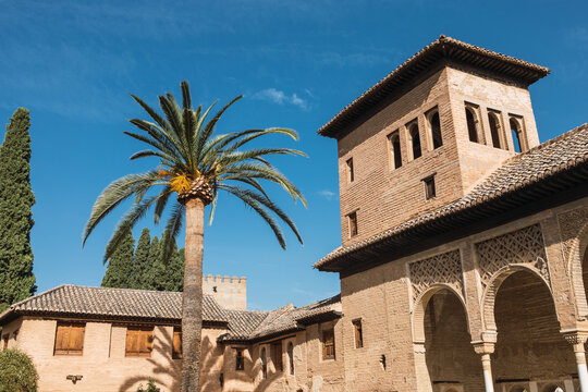 Exterior of historic Ladies Tower against blue sky located at Alhambra complex in Grenada, Spain during sunny day