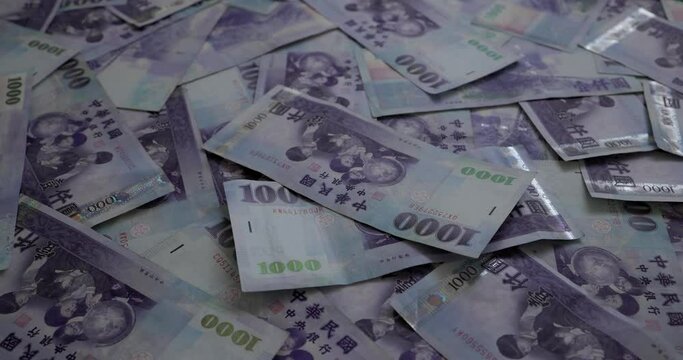 New taiwan dollar under red and blue police light, money laundry concept