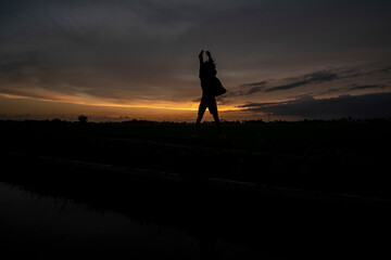 Silhouette photo at sunset with a beautiful sky background