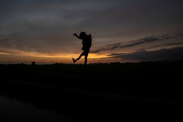 Silhouette photo at sunset with a beautiful sky background