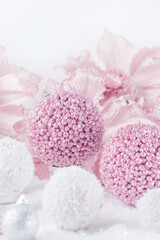Merry Christmas. Christmas banner in pink color on a white Christmas background. Christmas background, pink xmas holiday card. Christmas card pink balls