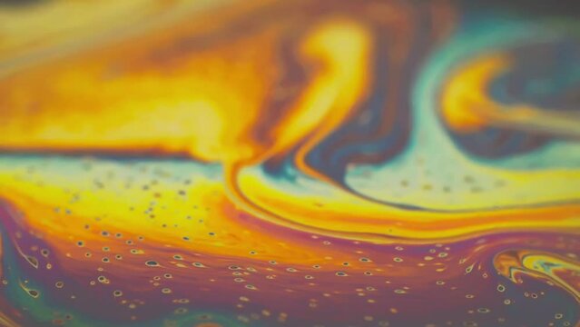 Abstract colorful swirls and gradients in a fluid art pattern.