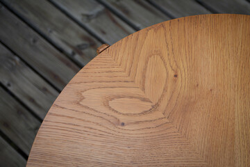 Oak wood tabletop. Oak veneer structure. Rounded table. 