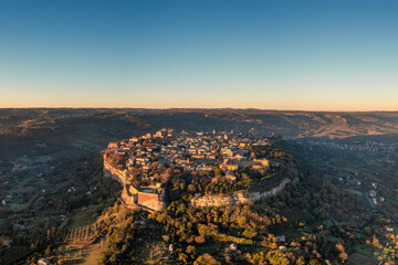 drone view of the historic clifftop city of Orvieto in Italy at sunrise