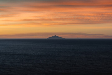 Naklejka premium Tyrrhenian Sea with the island of Pianosa near Elba at sunrise